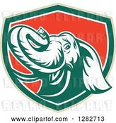 Vector Clip Art of Retro Angry Elephant in a Green White and Red Shield by Patrimonio
