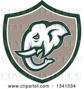 Vector Clip Art of Retro Elephant Head in a Green White and Taupe Shield by Patrimonio