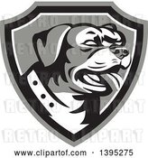 Vector Clip Art of Retro Panting Rottweiler Head in a Shield by Patrimonio