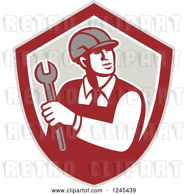 Vector Clip Art of Retro Male Worker Holding a Spanner Wrench in a Shield
