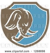 Vector Clip Art of Retro Cartoon Woodcut Charging Elephant in a Taupe Brown White and Blue Shield by Patrimonio