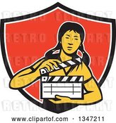 Vector Clip Art of Retro Female Asian Film Crew Worker Holding a Clapper in a Black White and Red Shield by Patrimonio