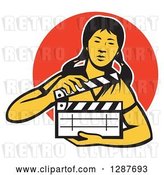 Vector Clip Art of Retro Female Asian Film Crew Worker Holding a Clapper over an Orange Circle by Patrimonio