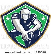 Vector Clip Art of Retro Gridiron American Football Player with His Hand on a Ball in a Star Shield by Patrimonio