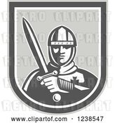 Vector Clip Art of Retro Knight Holding a Sword in a Shield by Patrimonio