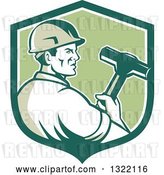 Vector Clip Art of Retro Male Construction Worker Holding a Sledgehammer in a Green and White Shield by Patrimonio
