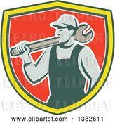 Vector Clip Art of Retro Male Mechanic Holding a Giant Wrench over His Shoulder in a Green Yellow White and Red Shield by Patrimonio