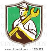 Vector Clip Art of Retro Male Mechanic Holding a Wrench and Emerging from a Taupe White and Green Shield by Patrimonio