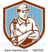 Vector Clip Art of Retro Male Mechanic Holding a Wrench, with Folded Arms, in a Brown White and Blue Shield by Patrimonio