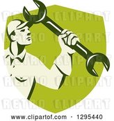 Vector Clip Art of Retro Male Mechanic Holding up a Wrench in a Green Shield by Patrimonio