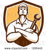 Vector Clip Art of Retro Male Mechanic with Folded Arms, Holding a Wrench in a Brown White and Yellow Shield by Patrimonio