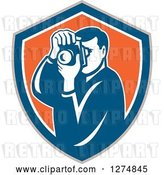 Vector Clip Art of Retro Male Photographer Taking Pictures in a Taupe Blue White and Orange Shield by Patrimonio