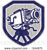 Vector Clip Art of Retro Movie Camera in a Shield by Patrimonio