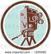 Vector Clip Art of Retro Movie Camera over a Pastel Blue and Brown Circle by Patrimonio
