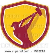 Vector Clip Art of Retro Silhouetted Male Demolition Worker Swinging a Sledgehammer in a Yellow Red and White Shield by Patrimonio