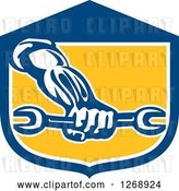 Vector Clip Art of Retro Strong Mechanic Hand Holding a Wrench in a Blue White and Yellow Shield by Patrimonio