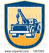 Vector Clip Art of Retro Tow Truck in a Yellow and Blue Shield by Patrimonio