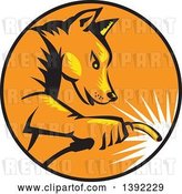 Vector Clip Art of Retro Woodcut Dingo Dog Welder in a Black Orange and Yellow Circle by Patrimonio