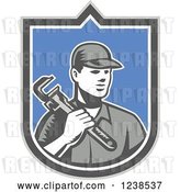 Vector Clip Art of Retro Woodcut Plumber Holding a Monkey Wrench in a Shield by Patrimonio