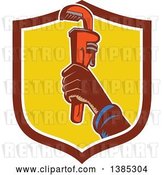 Vector Clip Art of Retro Woodcut Plumbers Hand Holding up a Monkey Wrench in a Shield by Patrimonio