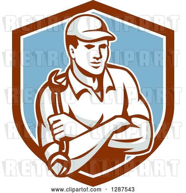 Vector Clip Art of Retro Male Mechanic Holding a Wrench, with Folded Arms, in a Brown White and Blue Shield