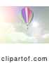 Clip Art of Retro 3d Hot Air Balloon Against a Cloudy Sky and Sunburst in Tones by KJ Pargeter